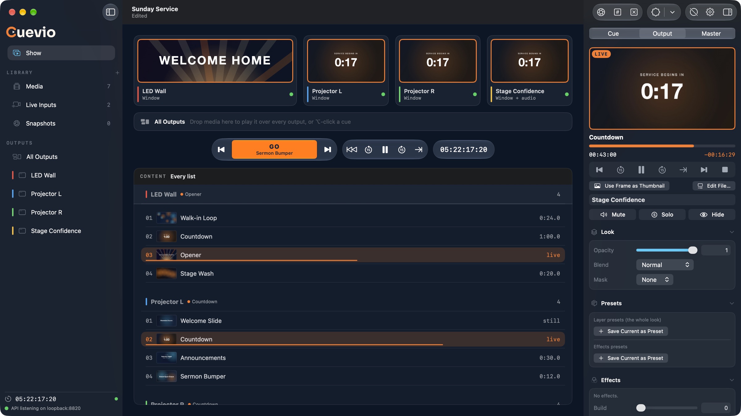 Cuevio's Show screen: live pictures of four outputs (an LED wall and two projectors showing a countdown, plus a stage confidence monitor) above the GO button, master transport and timecode, with each output's cue list below and the Output inspector on the right.